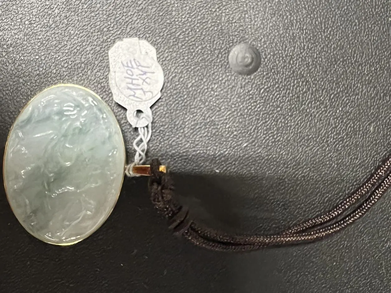 Carved Icy Jadeite Oval Pendant on Silk Cord