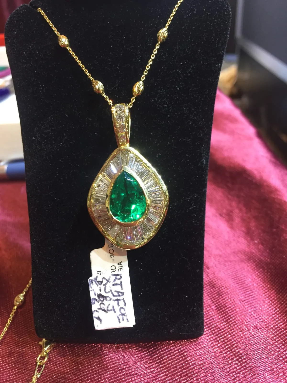 Pear Emerald Pendant with Baguette Diamond Halo
